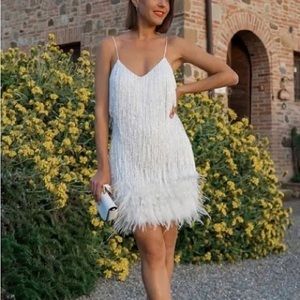 White fringed sequin feather trim mini dress. From Beachside Bunny